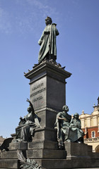 Obraz premium Monument to Adam Mickiewicz on Main square in Krakow. Poland