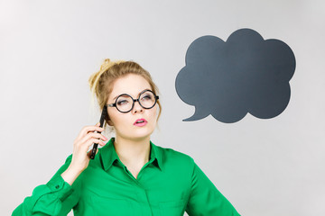 Business woman talking on phone with thinking bubble