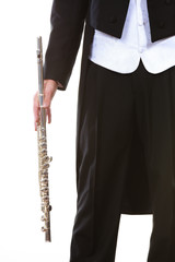 Male flutist wearing tailcoat holds flute