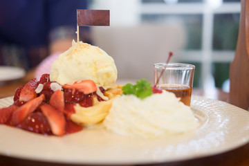 Sweet waffles with slice of strawberry