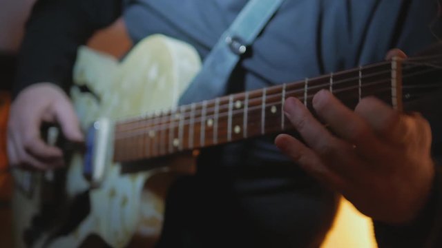 4k Musician plays country songs at recording studio by electric vintage guitar