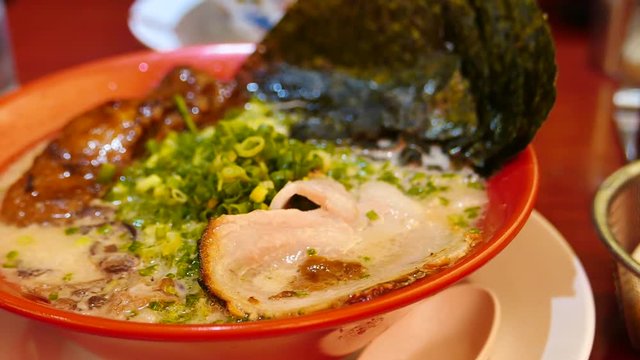 ramen, a japanese and chinese traditional food. with Tonkotsu a Pork Bone broth soup and chashu pork. 