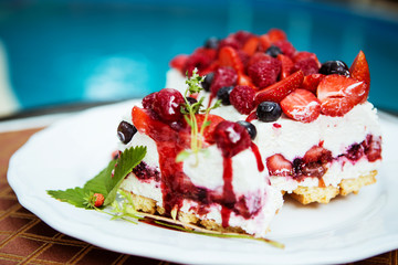 cake with strawberries and forest berries