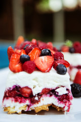 cake with strawberries and forest berries