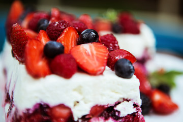cake with strawberries and forest berries