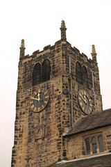 The Clock Tower of a Vintage Stone Built Church.