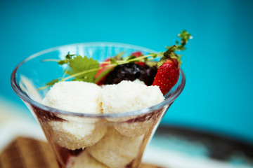 ice-cream with strawberries and forest berries