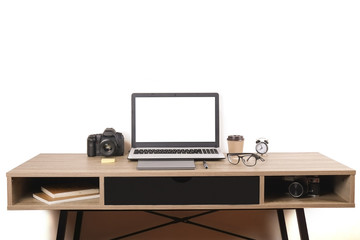 Photo blogger / photographer / it specialist's typical office space table with laptop, blank screen, coffee cup and electronics. Top view, copy space, flat lay, overhead, backdrop.