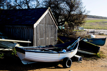 Boat by a boat house