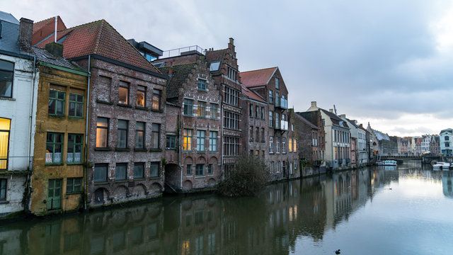 Picturesque medieval buildings on Leie river in Ghent town, Belgium, Europe.