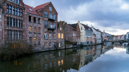 Fototapeta na wymiar Picturesque medieval buildings on Leie river in Ghent town, Belgium, Europe.