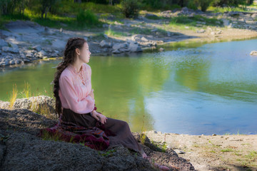 Beautiful young sad woman, dressed in the style of Boho