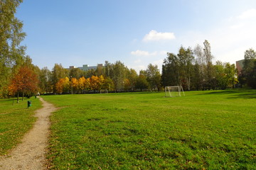Fototapeta na wymiar Autumn in park with colorful trees