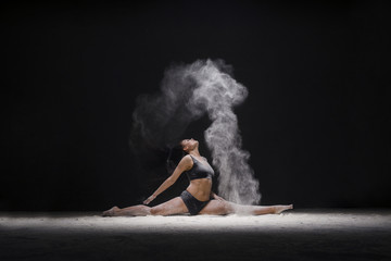 Woman in a split view in a white dust cloud