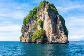 The limestone rock and islet Goh Dorkmai or Koh Dok Mai, on the way to the Phi Phi islands in the Andaman sea