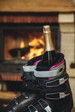 Boots ski boots in front of  fireplace