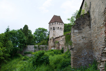 Fototapeta na wymiar Tower and walls of the Sighisoara Citadel in Transylvania, Romania