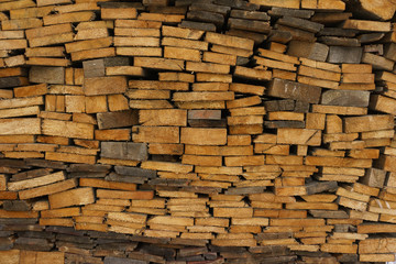 Woodpile. Thin boards stacked on top of each other. 