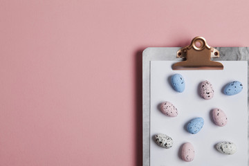 Easter eggs on a clipboard background