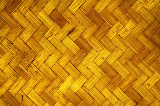 Orange Fragment of parquet floor. Wooden background, texture for mobile devices and website