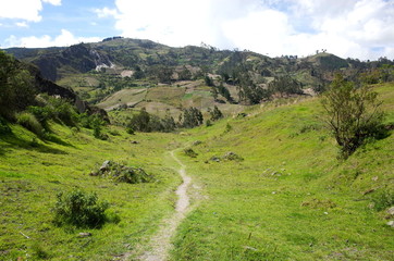 Fototapeta na wymiar A mountain track winds through the Ecuadorian Andes on the Quilotoa Loop hike