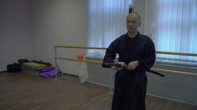 Medium Shot, Master Kendo Pulls Katan's Sword from Sheath and Sticks It Back in Sheath