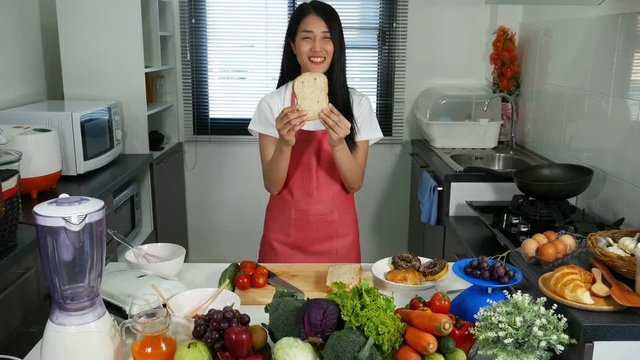 4k of woman holding a bread in kichen room at home