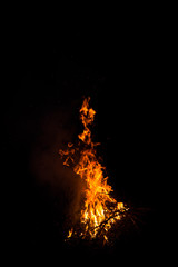 Fire burning dry vegetation at night
