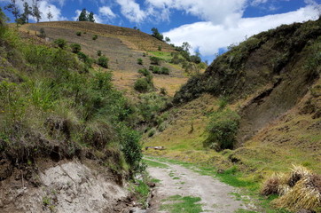 A mountain track winds through the Ecuadorian Andes on the Quilotoa Loop hike