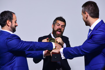 Coworkers or partners fight for winning competition. Leaders hold prize