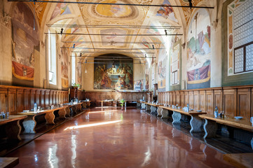 Fototapeta na wymiar The Baroque interior and frescoes of the Abbey of Monte Oliveto Maggiore is a large Benedictine monastery in the Italian region of Tuscany, near Siena.