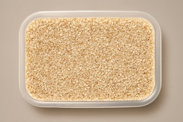 Whole Grains. Top View of Healthy grain foods in a White bowl on grey background with Real Shadow.