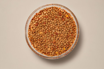 Whole Grains. Top View of Healthy grain foods in a Glass bowl on grey background with Real Shadow.