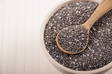 Chia seeds in a wooden bowl