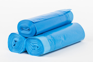 Rolls of disposable trash bags isolated on white background.