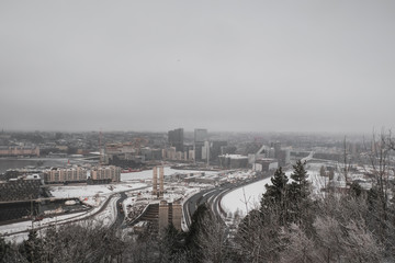Top view of the modern city of Oslo: Winter and snowy landscape typical of Nordic countries from the top of Ekeberg Park's entrance, Norway