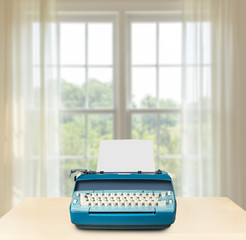 Electric typewriter in front of bright window