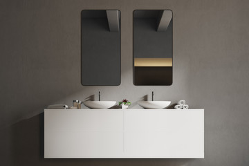 White sink vanity unit in a gray bathroom