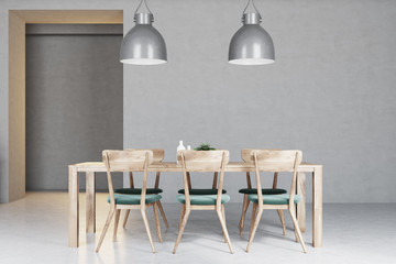 Wooden table in a light gray kitchen