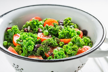 Closeup of spring kale salad full of vitamin and minerals