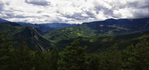Fototapeta na wymiar Green and rocky landscape from Mirador de Gresolet. Pyrenees, Catalonia, Spain