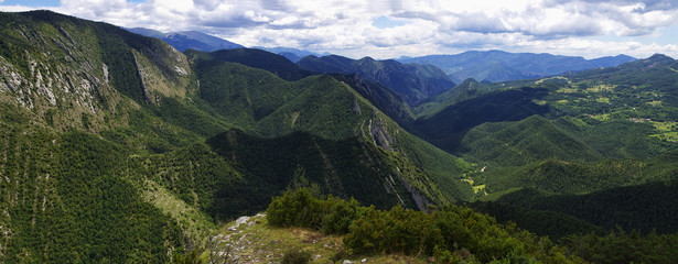 Fototapeta premium Green and rocky landscape from Mirador de Gresolet. Pyrenees, Catalonia, Spain