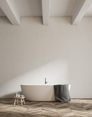 Obraz na płótnie Canvas White tub in a white bathroom, minimalism