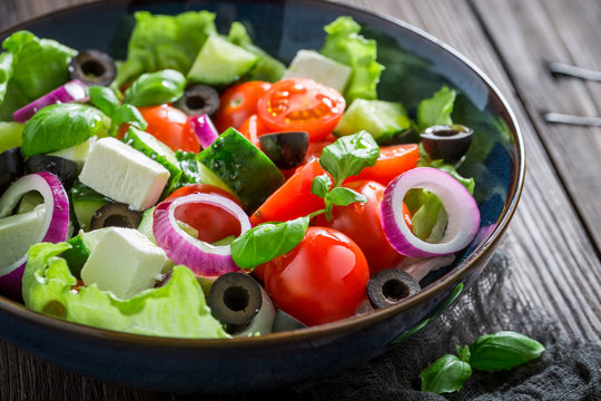 Closeup of Greek salad with feta cheese and black olives
