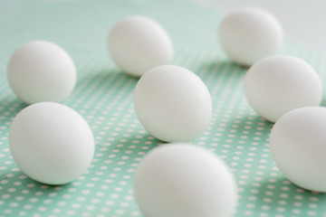 Eggs on dotted fabric background