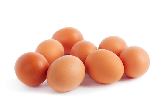 Fresh yellow chicken eggs on white  background