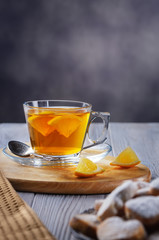 Tea with lemon and sweet biscuits