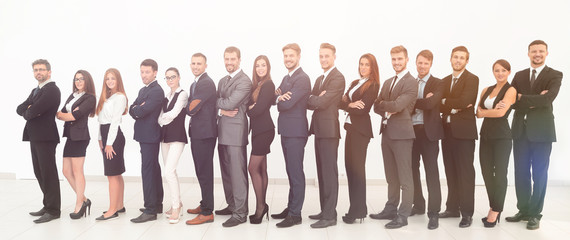 Obraz premium large business team standing arms crossed in front