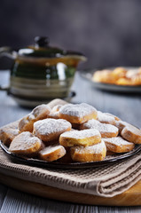 Tea with lemon and sweet biscuits