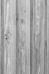 Weathered wood board wall texture background in black and white.